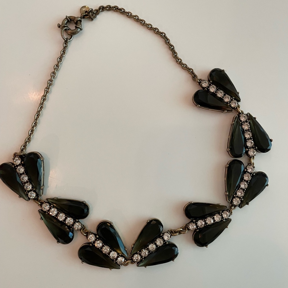 Black, crystal, and brass colored statement necklace